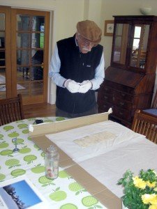 Prof Marston examines an artefact from the Time Capsule